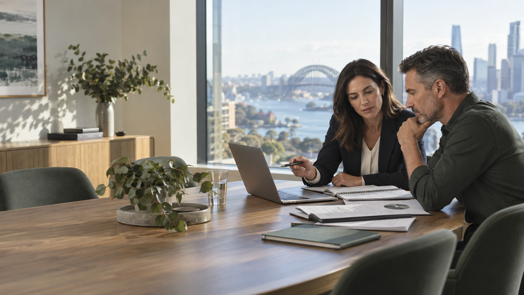 Business owner and financial professional reviewing records in a Sydney office